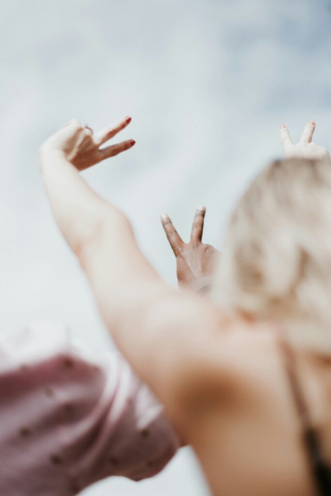 Hands making peace signs symbolising the calm that comes from setting healthy boundaries