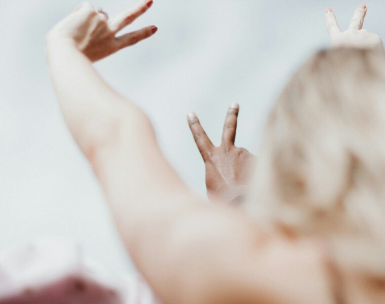 Hands making peace signs symbolising the calm that comes from setting healthy boundaries