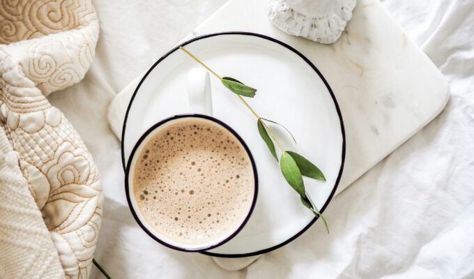 white teacup filled with coffee